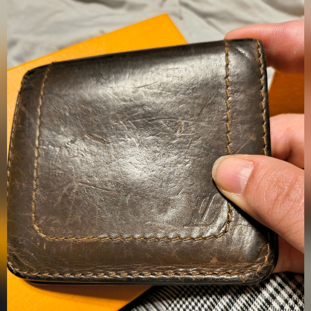 Louis Vuitton Two Folded Wallet made from Utah leather.